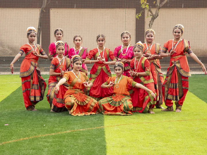 Students in costume performing a classical dance at Annual Day