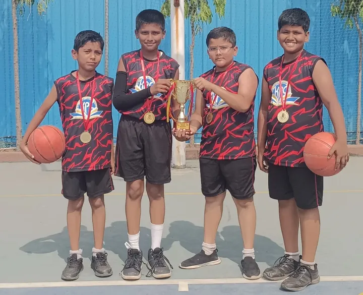 KPC students holding their basketball medals and trophy